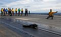 US Navy 070731-N-8923M-022 Lt. Timothy Castro shoots his boots from catapult 3 aboard the Nimitz-class aircraft carrier USS Harry S. Truman into the Atlantic Ocean.jpg
