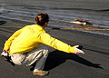 US Navy 100320-N-4236E-148 Lt. Cmdr. Kim Dacosta catapults her boots off the flight deck of USS Dwight D. Eisenhower to commemorate her last launch aboard the ship.jpg